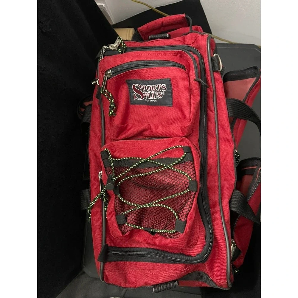 Olympia Sports Plus Red Rolling Duffel Bag Travel Luggage Retractable Handle